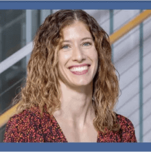 Woman smiling and staring ahead